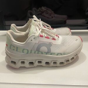 On Running White and Pink Sneakers with Cloud-Like Sole